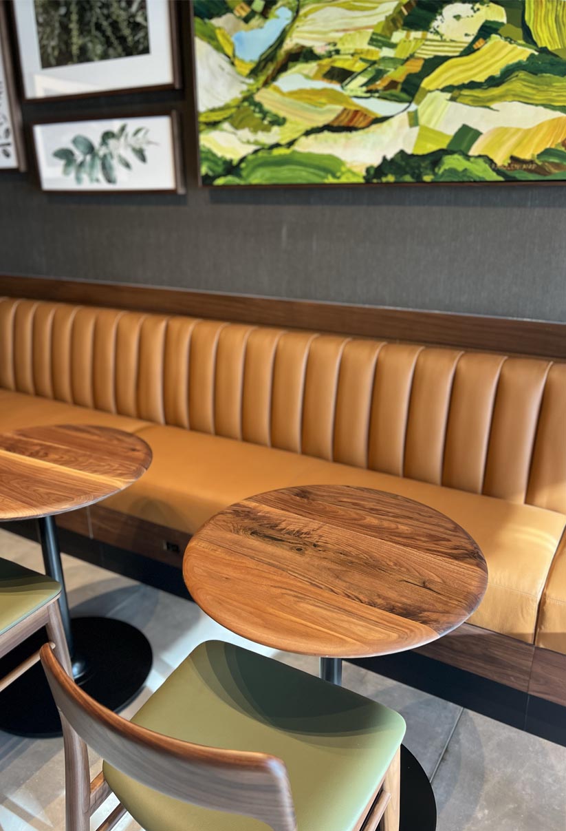 Warm-wood banquette seating built by Form Construction for an Ohio hospitality space.