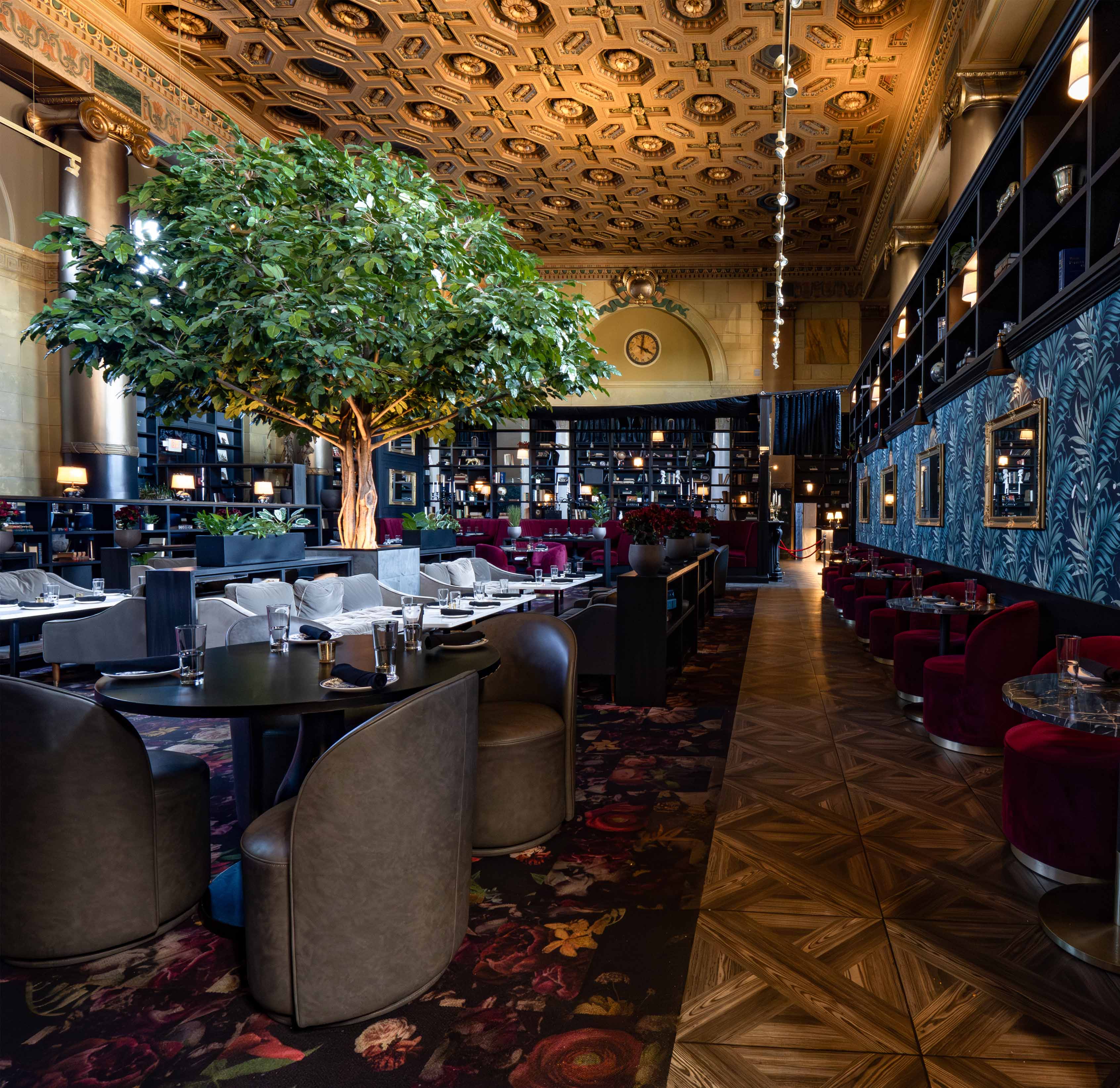 A Form Construction restaurant buildout — custom banquette seating, warm woodwork, and a moody bar interior in Cleveland.